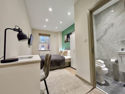 First-floor comfort awaits with a double bed, Smart 40" TV, WiFi, and ensuite. Enjoy a kitchenette with fridge freezer and tea & coffee, plus workspace, wardrobe, and hair dryer—everything you need for a cozy, home-like stay.