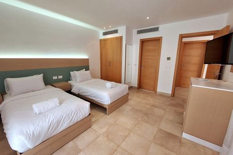 Each en suite room has it's own private bathroom, wardrobe, and smart TV, with  balcony or window overlooking the private pool or the private front yard, Hospitality serviced rooms  housekeeping, laundry, bath supplies, hairdryer, linens and towels