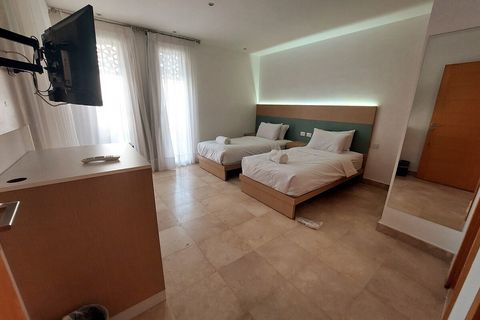 Each en suite room has it's own private bathroom, wardrobe, and smart TV, with  balcony or window overlooking the private pool or the private front yard, Hospitality serviced rooms  housekeeping, laundry, bath supplies, hairdryer, linens and towels