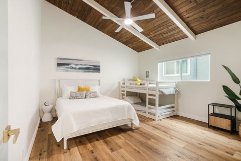 Large bedroom with a Queen and a fun bunk bed. Could be a private space for kids to hang out, toys in the closet.