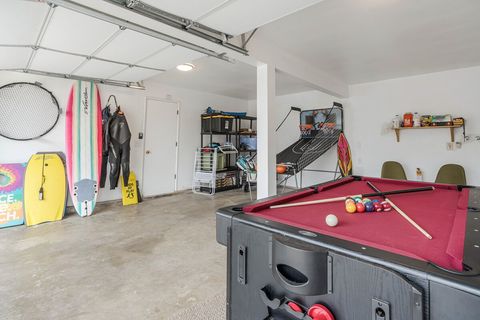 The Game room! Wet suits, surfboards, beach wagon, Pool, air hockey, arcade basketball, beach cruisers ++ ...
