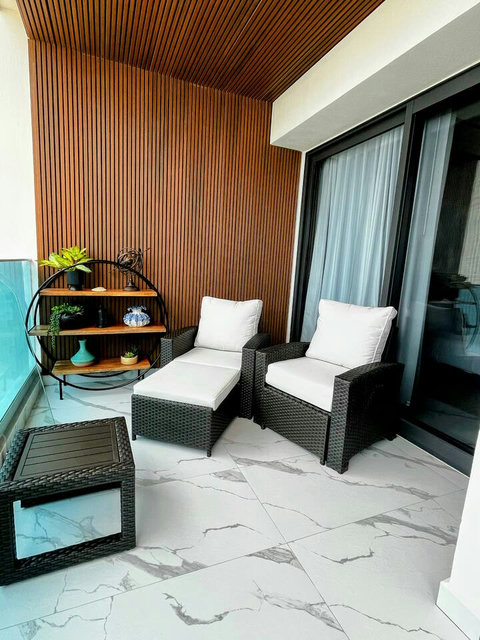 Both patio chairs and couch have a foot rest extension that pulls out from underneath and the pads fold out, making into a lounge chair and couch.