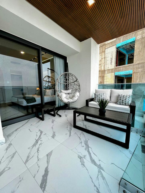 The couch has a foot rest extension that pulls out from underneath and the pads fold out, making into a lounging couch.  Great way to soak in the sun or take a nap.