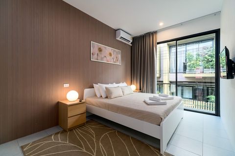 2nd bedroom with king sized bed, large dressing room and balcony outside.