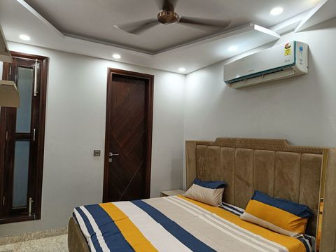 Well set up bedroom with 2 wall to wall almirahs with attached washroom with all imported bath fittings (Grohe), 1.5 tonne AC and smart TV