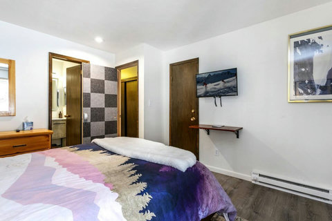 32 inch TV and a full walk-in closet. The picture is taken with a wide-angle lens, so the room may appear a bit smaller in person.
