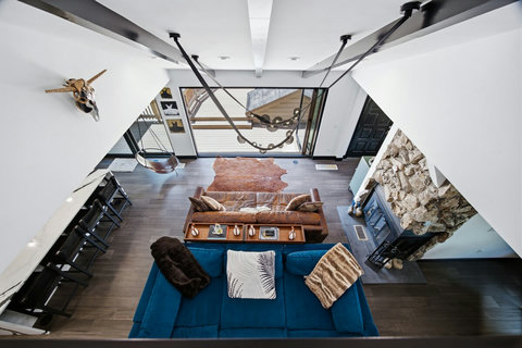 View from the loft of wood burning fireplace and living room