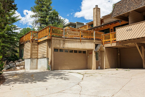 Mountain-style home with large sunny deck and private garage