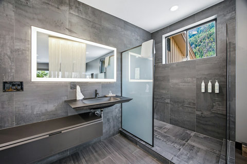 Stylish and Updated finishes abound in the en suite primary bathroom