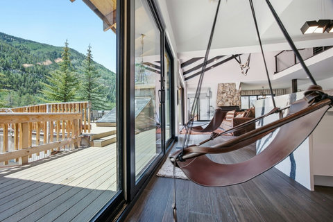 Yes, those are amazing swing chairs inside to enjoy that epic view!