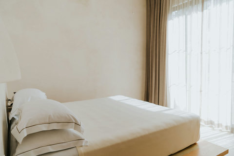 Cozy bedroom with natural light and minimalist decor