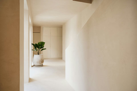 Bright, serene space with architectural details and lush greenery