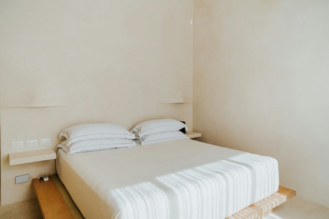 Cozy platform king-sized bed set in a relaxing, serene space