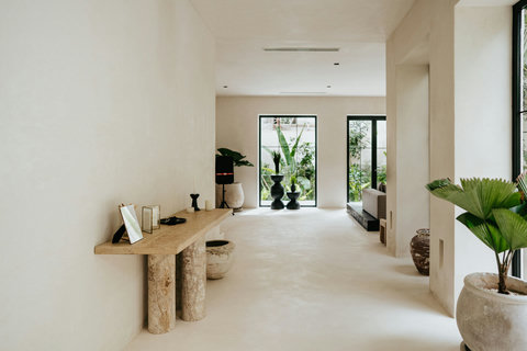 Bright, airy spaces with natural tones and lush indoor-outdoor views