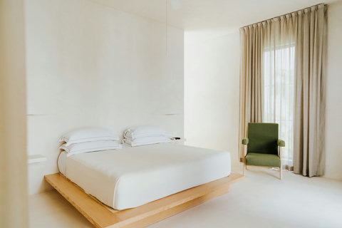 Spacious bedroom with platform bed and neutral tones