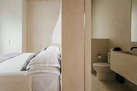 Plush bedroom with a private bathroom