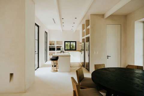Contemporary kitchen and dining space with tranquil garden views
