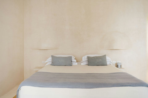 Comfortable platform bed with a soft, welcoming atmosphere