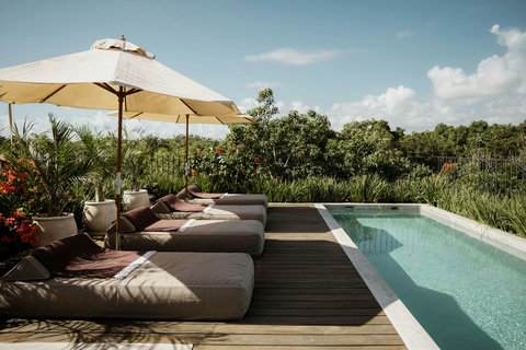 Private rooftop terrace featuring a pool and sweeping green views