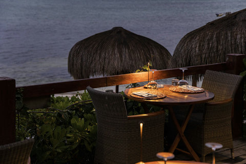 PANDANO RESTAURANT - Candlelight, woven textures, and the hush of the sea turn a simple table into an intimate evening ritual.
