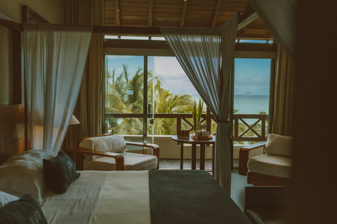 The doors open, the sea appears, and everything shifts into breeze, stillness, and a slower kind of time.