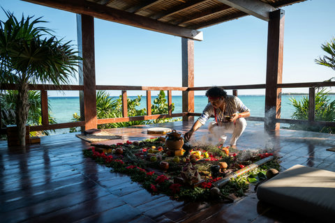 Smoke curls through the room as an ancestral blessing unfolds, grounding the day in scent, color, and intention.