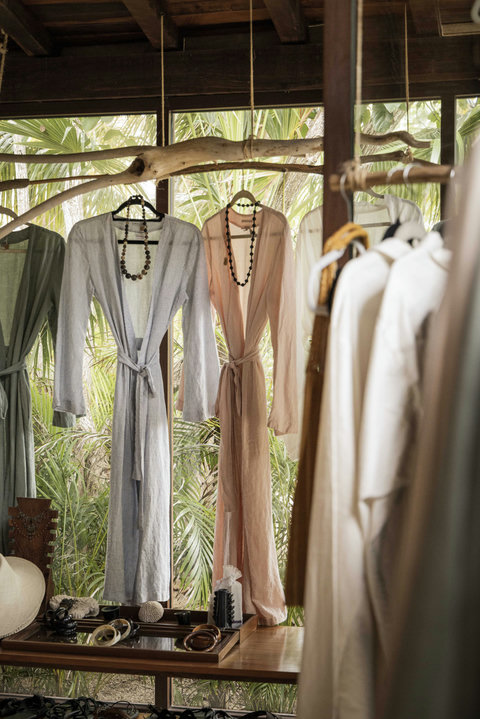 A shaded boutique moment, airy fabrics swaying lightly, where browsing feels more like wandering than shopping.