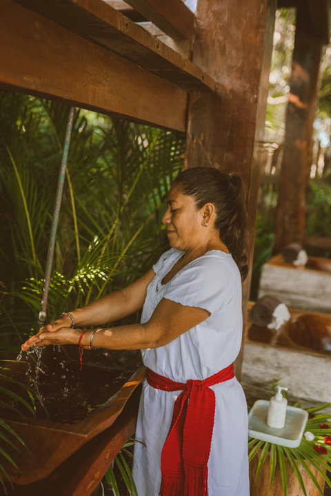 SPA & YOGA - Cool water flows over hands in a simple gesture that grounds the spirit before treatment begins.
