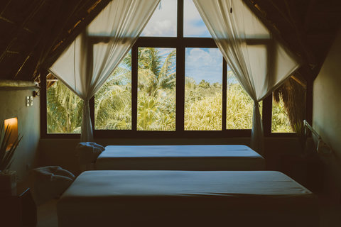 Soft linens and swaying palms frame a tranquil escape designed for deep rest and renewal.