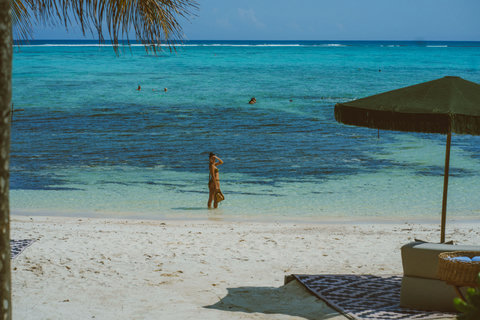 PRIVATE BEACH & BAY - Sunlit balconies peek through towering palms, golden planks creak softly, offering secluded siestas above the living green.