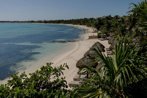 PRIVATE BEACH & BAY - Curving bay stretches quietly north, aquamarine shallows glimmering beside private palapas, inviting sunrise walks and barefoot discovery.
