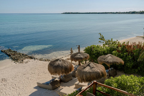 PRIVATE BEACH & BAY - Soft sand underfoot, palapa umbrellas awaiting; turquoise hush rolls in, offering the day’s first unhurried breath.