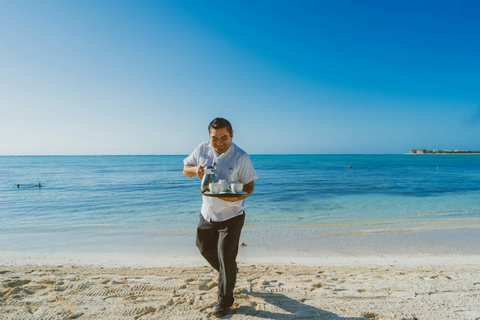 PANDANO RESTAURANT - Fresh coffee arrives along the shoreline, bringing the simple luxury of a perfect morning by the sea.