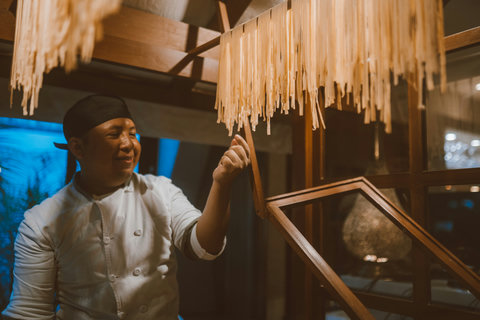 PANDANO RESTAURANT - The chef’s gentle smile reveals the care behind hanging pastas, crafting tonight’s menu with quiet pride.