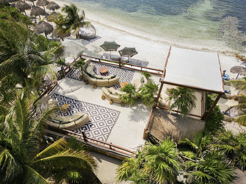 LOUNGE AREAS - Rooftop again, sea shifting colours below; new angles reveal canopy waves answering every passing breeze.