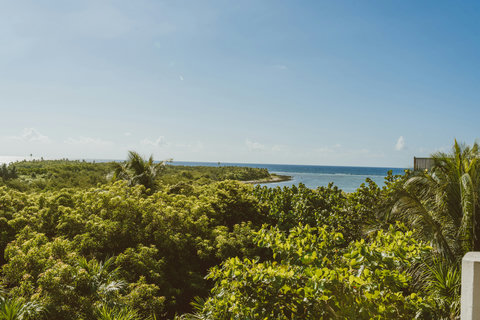 HOTEL VIEWS - First sight: endless emerald canopy meets sapphire horizon; warm salt breeze signals the slowdown officially begins here.