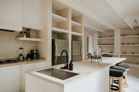 Modern kitchen details with stone island and black accents