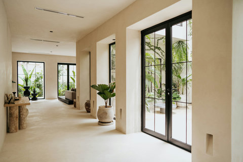 Bright corridor with modern decor and potted plants