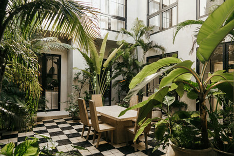 Charming courtyard dining with verdant surroundings