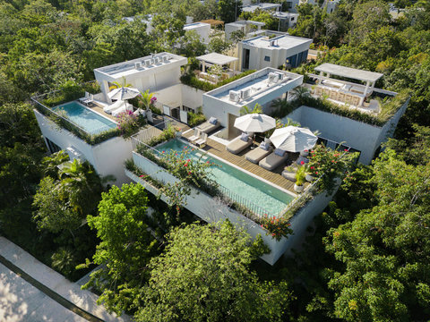 An elevated sanctuary of modern villas, private pools, and lush green surroundings