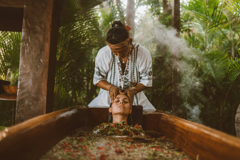 SPA & YOGA - Surrender to hands that trace calm across your brow, submerged in floral waters beneath leafy canopy — steam rising like breath, grounding you in ancient rhythm and gentle release.