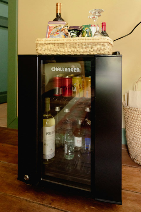 Minibar - Welcome to your cozy retreat, where warm lighting sets the perfect mood and a fully stocked mini-bar awaits to enhance your stay. Sip, relax, and unwind in style. 🍷✨