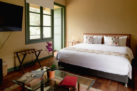 Bedroom  - Escape to tranquility in this sunlit haven, where comfort and charm embrace you. Enjoy morning coffee by the open window, surrounded by lush greenery and soothing hues. Perfect harmony awaits you with plush bedding, elegant decor, and a peace