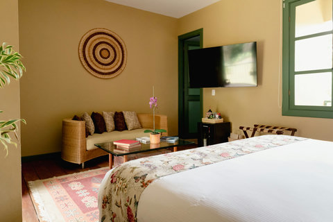 Bedroom - 🌿 Escape to tranquility in this beautifully lit sanctuary, where warm hues create a cozy ambiance. Relax on the plush sofa, catch your favorite shows on the smart TV, and enjoy the subtle charm of thoughtful decor. Your peaceful retreat awaits