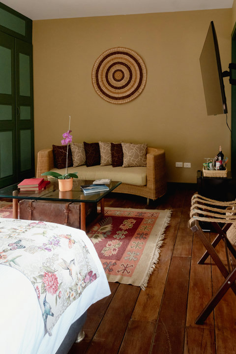 Bedroom - Embrace the cozy charm of this inviting retreat, where warm lighting highlights rustic decor and comfort meets style. Unwind on the plush sofa, enjoy a good book, or simply bask in the serene ambiance. Your perfect getaway awaits with all the