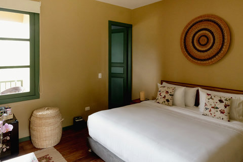 Bedroom - Unwind in this cozy oasis filled with warm hues and inviting textures. Let natural light stream through, highlighting charming rustic details and ample amenities for your perfect getaway.