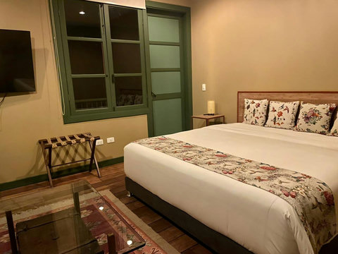 Bedroom - Step into serene comfort where soft natural light dances across the room, highlighting the elegant floral accents. Embrace the tranquility with plush bedding and unwind on the cozy balcony just a step away. Your perfect retreat awaits.