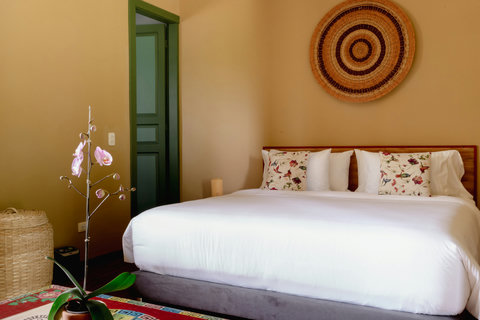 Bedroom  - Unwind in a serene oasis where warm earth tones meet vibrant floral accents. Bask in the soft, natural light that flows through this tranquil retreat, offering a perfect balance of comfort and elegance. 🌿✨