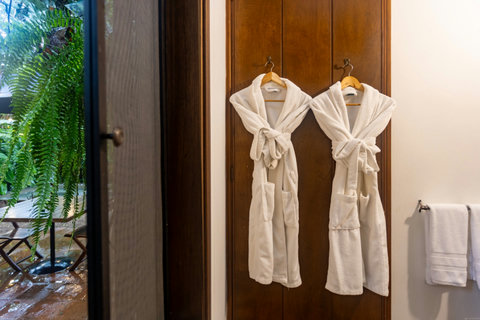 Bathroom - Escape to tranquility in our serene retreat, where soft, ambient lighting and lush greenery set the perfect mood. Relax in plush robes and unwind with all the luxurious amenities you deserve. Your peaceful getaway awaits!