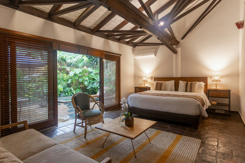 Bedroom 2 - Step into a serene oasis where warm lighting and earthy tones create a soothing escape. Enjoy cozy comforts with lush garden views and inviting seating areas, perfect for relaxation or intimate gatherings.✨🌿 #RetreatVibes #CozyComfort
